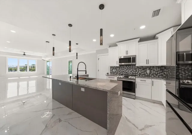3rd image of 211 Dolphin Pt #303, Clearwater Beach, FL 33767 | MLS# TB8485711