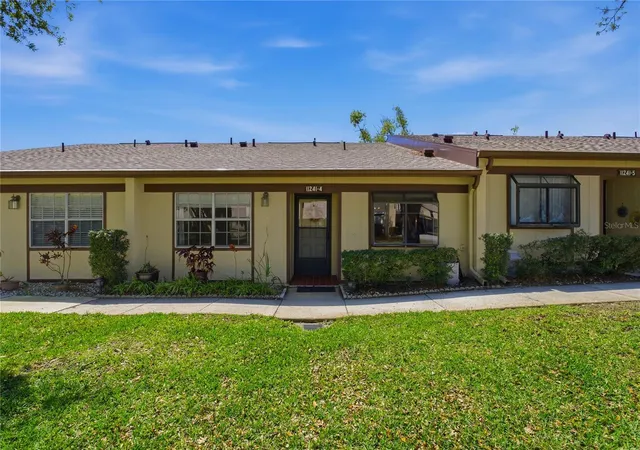 1st image of 11241 Dollar Lake Dr #4, Port Richey, FL 34668 | MLS# W7883901