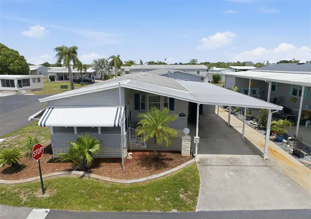 Photo 1 of Manufactured home for sale at 6907 Americana Dr Ne #101, St Petersburg, FL 33702 | MLS# TB8486983 | Listing updated on 2026-09-12