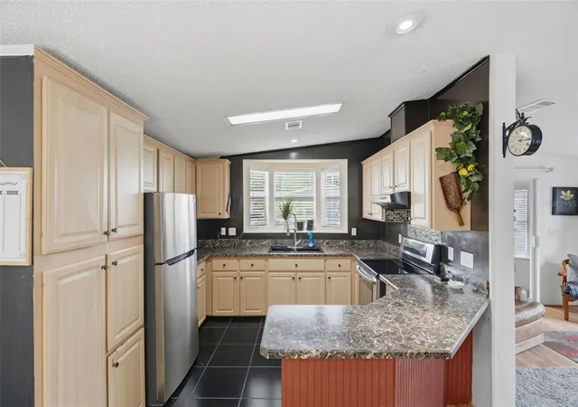 Photo 4 of Manufactured home for sale at 6907 Americana Dr NE #101, St Petersburg, FL 33702 | MLS# TB8486983 | Listing updated on 2026-09-12