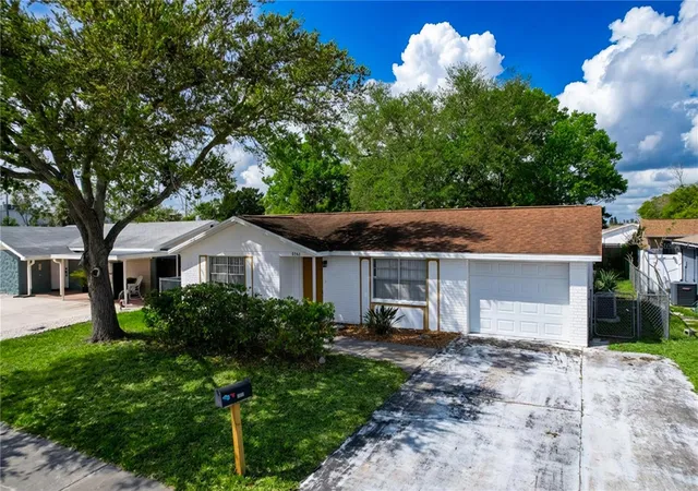 Photo 2 of Single family home for sale at 9741 Lamantin Dr, Port Richey, FL 34668 | MLS# W7883926 | Listing updated on 2026-04-25