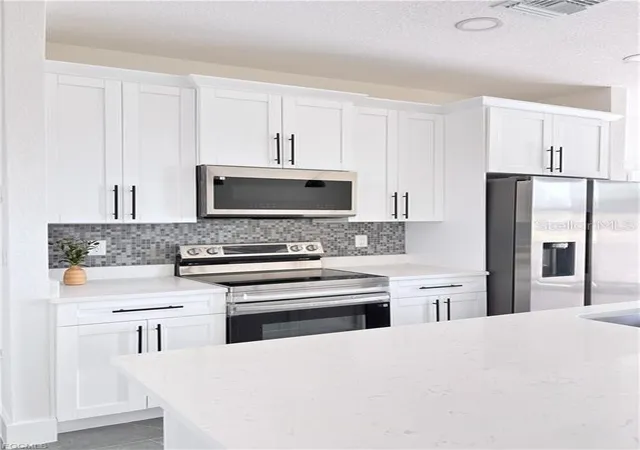4th image of 842 Giorgio Ave S, Lehigh Acres, FL 33974 | MLS# A4686402