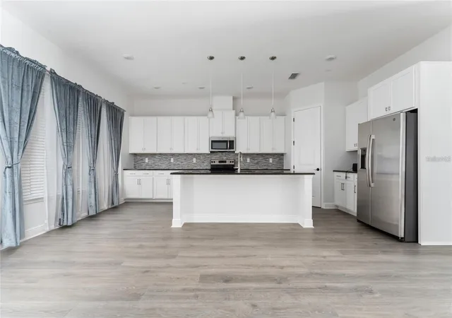 Photo 3 of Townhouse for sale at 13427 Stoddart Ave, Orlando, FL 32827 | MLS# S5146139 | Listing updated on 2026-10-19
