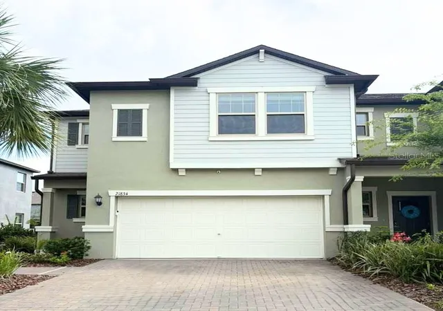 Photo 1 of Townhouse for sale at 21834 Adriatic Ln, Land O Lakes, FL 34637 | MLS# TB8488405 | Listing updated on 2026-08-31