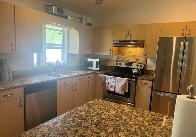 Photo 3 of Single family home for sale at 12849 SW 77th Circle, Ocala, FL 34473 | MLS# OM721211 | Listing updated on 2026-08-08