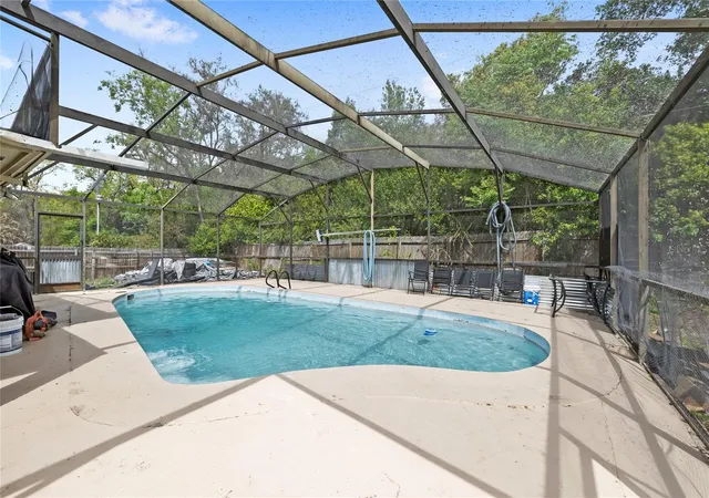 Photo 2 of Single family home for sale at 7033 Tallowtree Ln, Orlando, FL 32835 | MLS# O6393318 | Listing updated on 2026-09-16