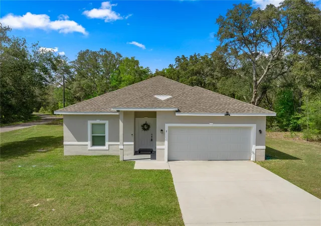 1st image of 2 Magnolia Pass Tr, Ocklawaha, FL 32179 | MLS# OM721757