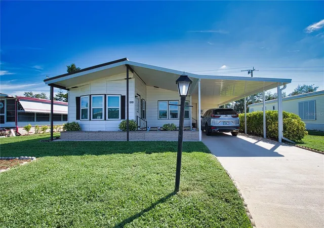 Photo 1 of Manufactured home for sale at 424 Tarde Logo Cir, North Port, FL 34287 | MLS# TB8492886 | Listing updated on 2026-09-22