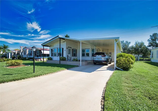 Photo 3 of Manufactured home for sale at 424 Tarde Logo Cir, North Port, FL 34287 | MLS# TB8492886 | Listing updated on 2026-09-22