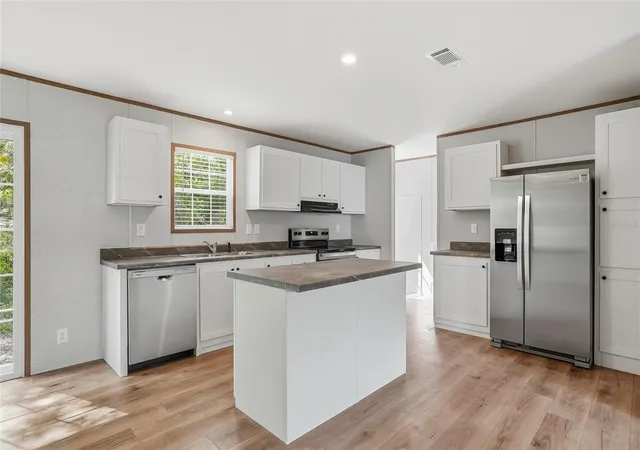 Photo 2 of Manufactured home for sale at 12015 Westbay Ave, New Port Richey, FL 34654 | MLS# TB8493271 | Listing updated on 2026-08-20