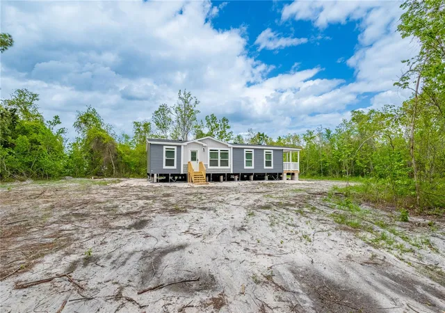 Photo 2 of Manufactured home for sale at 14823 Se County Rd 100a, Starke, FL 32091 | MLS# GC539124 | Listing updated on 2026-09-11