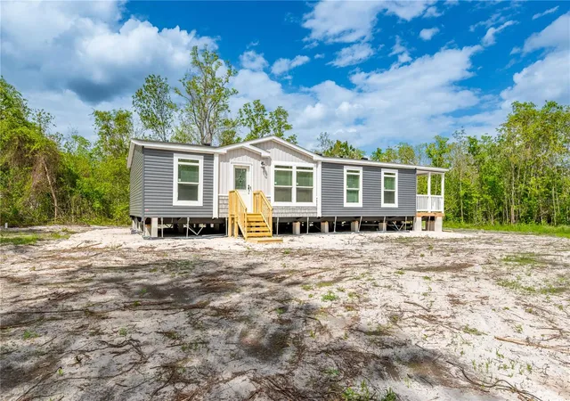 Photo 2 of Manufactured home for sale at 14823 SE County Rd 100a, Starke, FL 32091 | MLS# GC539124 | Listing updated on 2026-09-11
