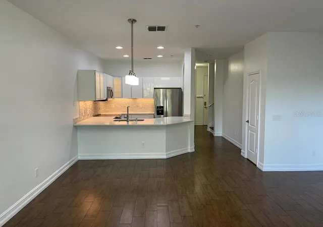 Photo 4 of Townhouse for sale at 3153 Capri Isle Way, Orlando, FL 32835 | MLS# O6396126 | Listing updated on 2026-08-31