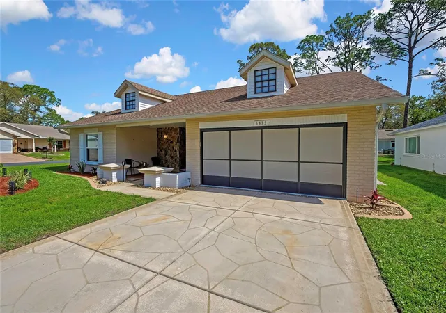 Photo 3 of Single family home for sale at 6433 Lost Tree Ln, Spring Hill, FL 34606 | MLS# W7884566 | Listing updated on 2026-09-17