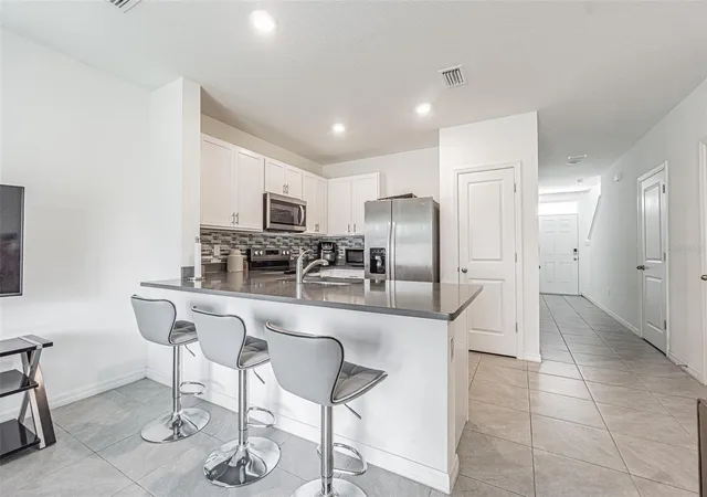 Photo 3 of Townhouse for sale at 6358 Sophie Oaks Ct, Tampa, FL 33610 | MLS# TB8495850 | Listing updated on 2026-08-11
