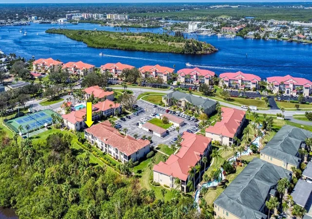 Listing Photo 1 - Condo for sale in building located at 402 Bouchelle Dr, New Smyrna Beach, FL 32169 - Unit #206