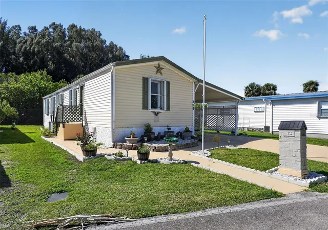 Photo 3 of Manufactured home for sale at 132 Holiday Park Blvd Ne, Palm Bay, FL 32907 | MLS# O6398209 | Listing updated on 2026-04-15