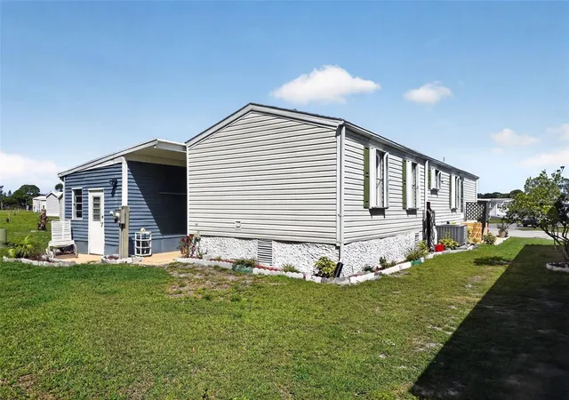 Photo 3 of Manufactured home for sale at 132 Holiday Park Blvd NE, Palm Bay, FL 32907 | MLS# O6398209 | Listing updated on 2026-04-15