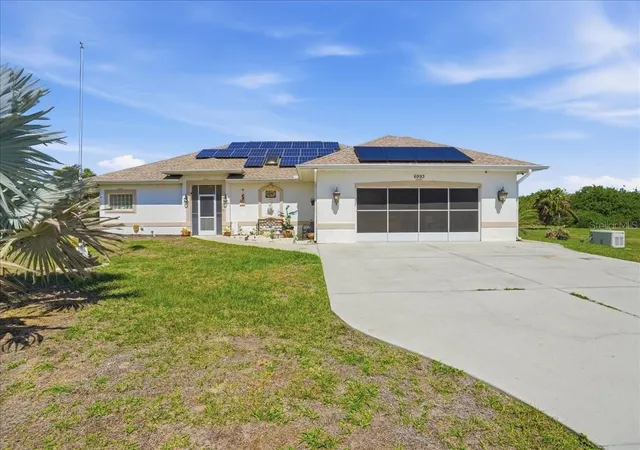 Photo 1 of Single family home for sale at 6993 Manniz Rd, Port Charlotte, FL 33981 | MLS# A4689642 | Listing updated on 2026-04-12