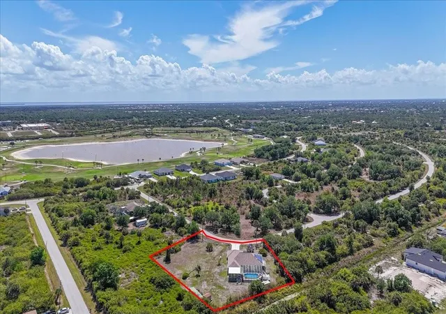 Photo 2 of Single family home for sale at 6993 Manniz Rd, Port Charlotte, FL 33981 | MLS# A4689642 | Listing updated on 2026-04-12