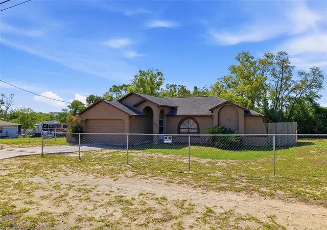 Photo 2 of Single family home for sale at 10464 Maderia St, Spring Hill, FL 34608 | MLS# W7884778 | Listing updated on 2026-07-06