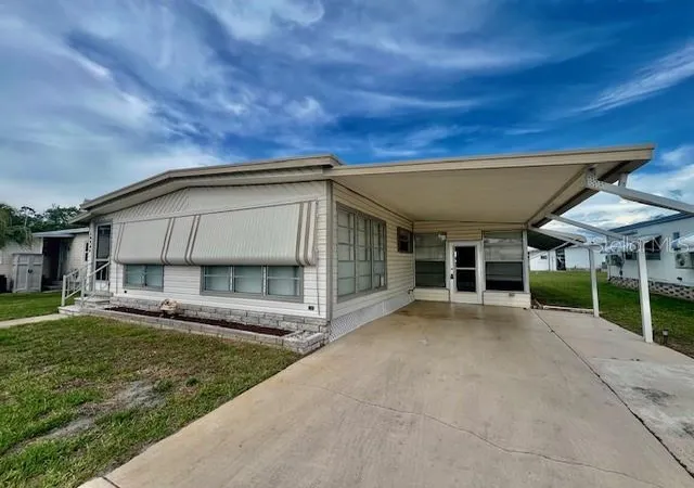 Photo 1 of Manufactured home for sale at 10920 Independence Dr, Port Richey, FL 34668 | MLS# W7884810 | Listing updated on 2026-07-25