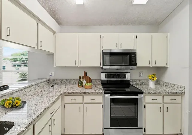 4th image of 8710 Triple Oaks Rd, Temple Terrace, FL 33637 | MLS# O6398871