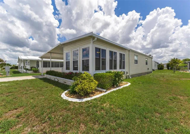 Photo 3 of Manufactured home for sale at 716 Sanchez Cir, North Port, FL 34287 | MLS# TB8497659 | Listing updated on 2026-09-22
