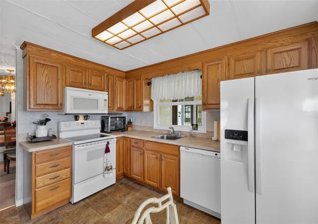 Photo 4 of Manufactured home for sale at 716 Sanchez Cir, North Port, FL 34287 | MLS# TB8497659 | Listing updated on 2026-09-22