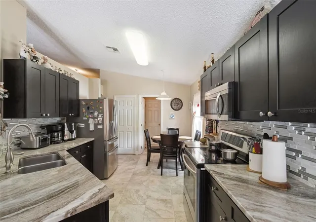 Photo 4 of Single family home for sale at 1504 Fort Meade Pl, Kissimmee, FL 34759 | MLS# O6399399 | Listing updated on 2026-10-07