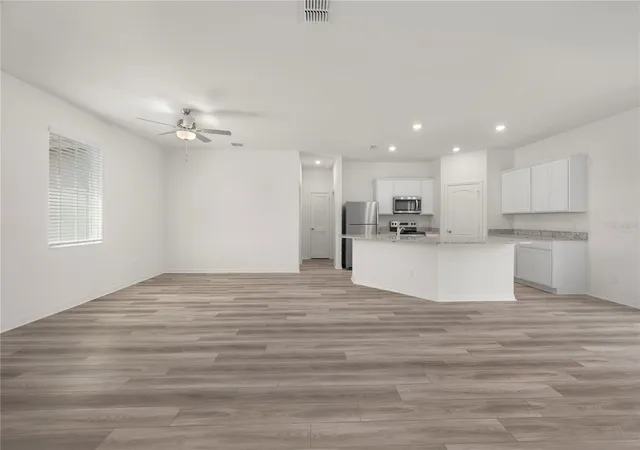 Photo 3 of Single family home for sale at 404 Manitoba Ln, Kissimmee, FL 34759 | MLS# TB8498641 | Listing updated on 2026-10-07