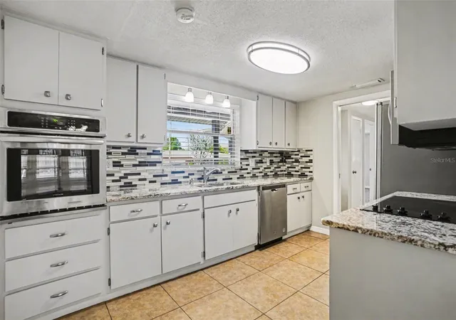 5th image of 8006 Mimosa Dr, Port Richey, FL 34668 | MLS# O6400076