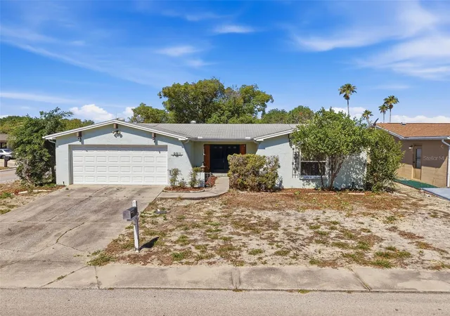 1st image of 9811 Woodstock Ln, Port Richey, FL 34668 | MLS# W7884997