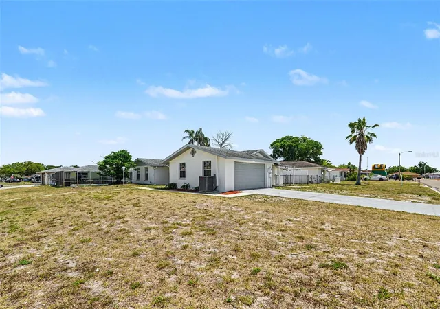 4th image of 7836 Lotus Dr, Port Richey, FL 34668 | MLS# O6400592