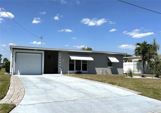 Photo 1 of Single family home for sale at 123 Poinsettia Cir Ne, Port Charlotte, FL 33952 | MLS# C7525256 | Listing updated on 2026-08-20