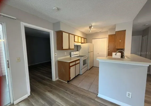 Homes for sale in Orlando, FL | 1087 S Hiawassee Road, Orlando, FL 32835 | Houzeo