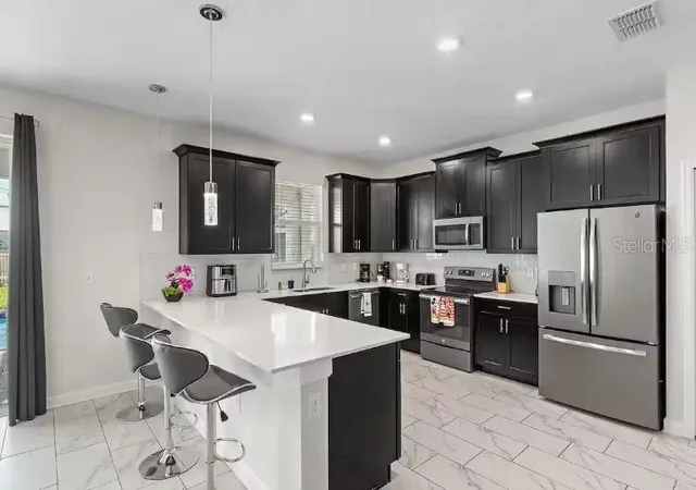 5th image of 913 Ocean Course Ave, Davenport, FL 33896 | MLS# O6402821