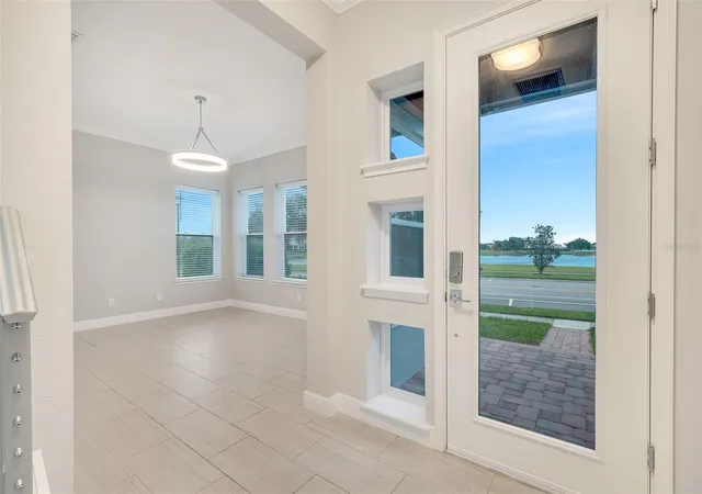 Photo 3 of Single family home for sale at 9044 Tavistock Lakes Blvd, Orlando, FL 32827 | MLS# O6402945 | Listing updated on 2026-08-12