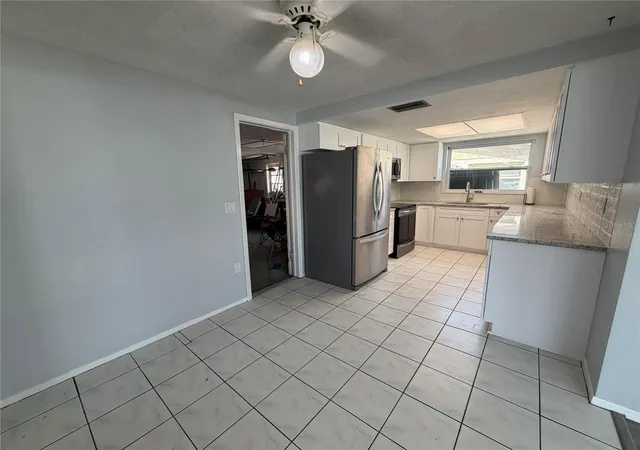 4th image of 10826 Piccadilly Rd, Port Richey, FL 34668 | MLS# O6404235
