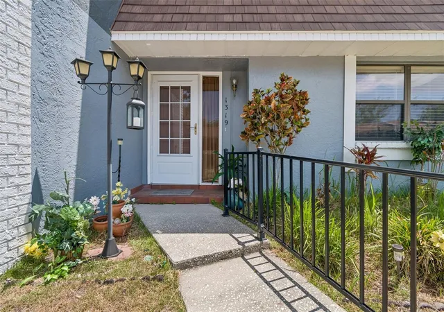 Photo 2 of Townhouse for sale at 1319 Abbey Crescent Ln, Clearwater, FL 33759 | MLS# TB8504296 | Listing updated on 2026-09-11