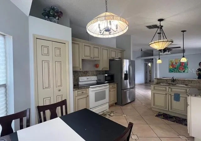 Photo 4 of Single family home for sale at 4125 Hampshire Village Ct, Orlando, FL 32822 | MLS# TB8504987 | Listing updated on 2026-10-25