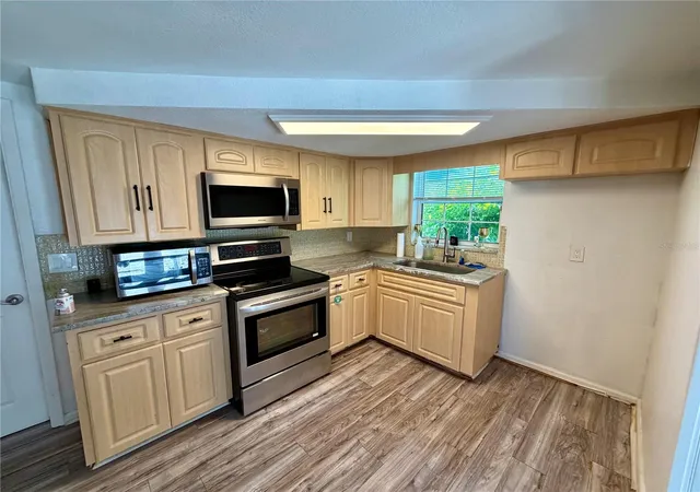 Photo 3 of Single family home for sale at 9331 Rainbow Ln, Port Richey, FL 34668 | MLS# TB8505590 | Listing updated on 2026-06-25