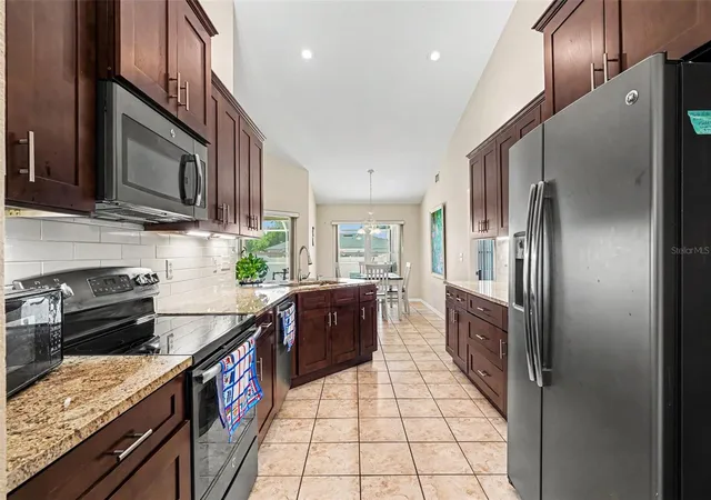Photo 3 of Single family home for sale at 113 Shaddock Dr, Auburndale, FL 33823 | MLS# TB8507219 | Listing updated on 2026-09-01