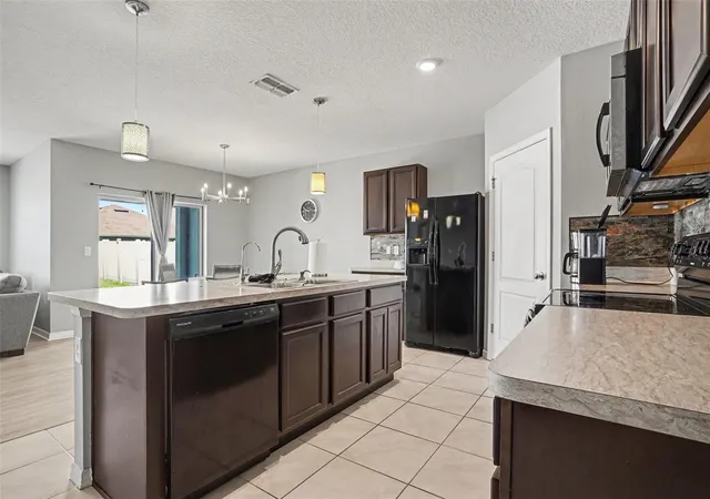 Photo 4 of Single family home for sale at 911 Waterville Dr, Auburndale, FL 33823 | MLS# TB8508539 | Listing updated on 2026-10-09