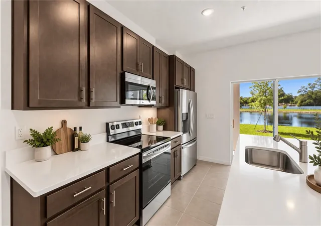Photo 4 of Townhouse for sale at 4899 Winding River Rd, Orlando, FL 32822 | MLS# W7885806 | Listing updated on 2026-09-25