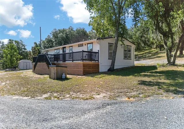 Photo 3 of Manufactured home for sale at 14318 Rock N Roll Rd, Clermont, FL 34715 | MLS# O6410265 | Listing updated on 2026-09-03
