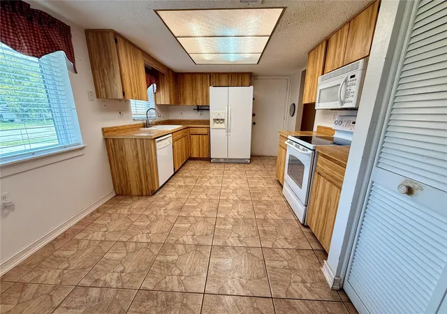 4th image of 8634 Winding Wood Dr, Port Richey, FL 34668 | MLS# W7886138