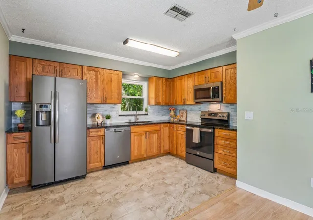 4th image of 6016 Wilds Dr, New Port Richey, FL 34653 | MLS# W7886242