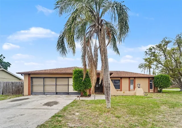 Photo 1 of Single family home for sale at 1215 Persimmon Dr, Holiday, FL 34691 | MLS# TB8514707 | Listing updated on 2026-09-25
