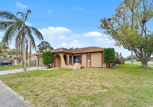 Photo 2 of Single family home for sale at 1215 Persimmon Dr, Holiday, FL 34691 | MLS# TB8514707 | Listing updated on 2026-09-25